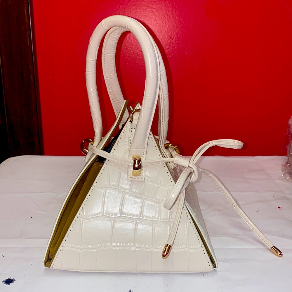 Croc Triangle handbag or crossbody bag.